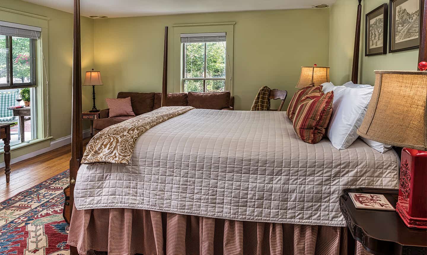 Arrowhead Room bed with couch in background