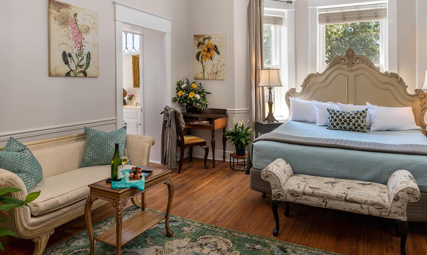 Couch, bench, and bed in Penelope Barker Suite