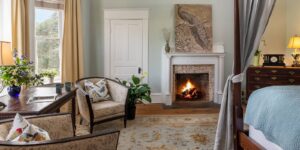 Fireplace and two chairs in Charles Eden Suite
