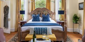 Bed in Daniel Earle Suite with bench