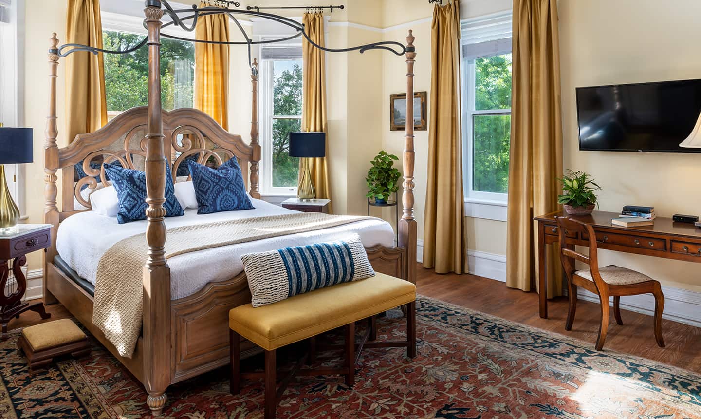 Bed in Daniel Earle Suite with bench