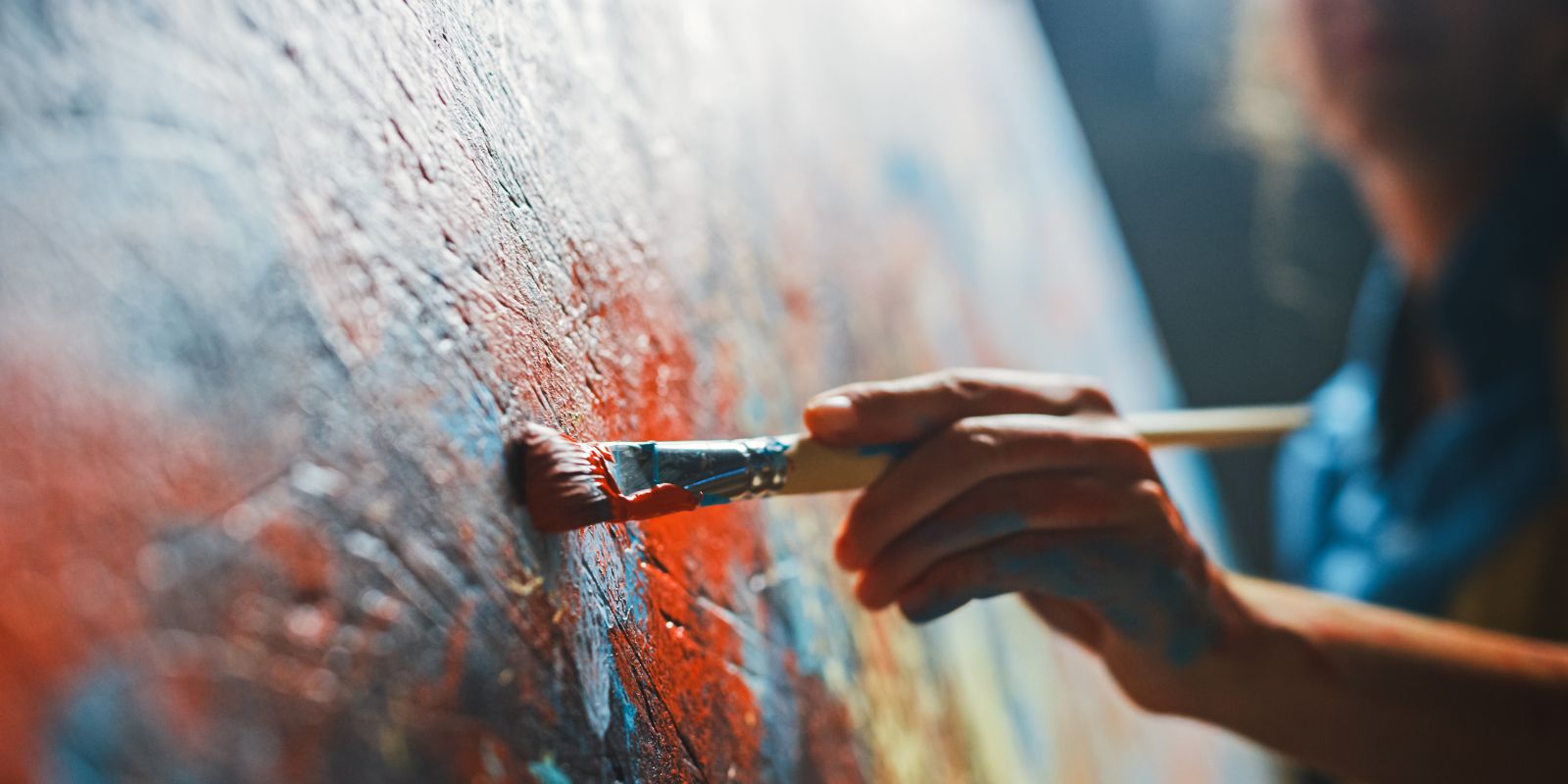 Close up of artist painting on a canvas