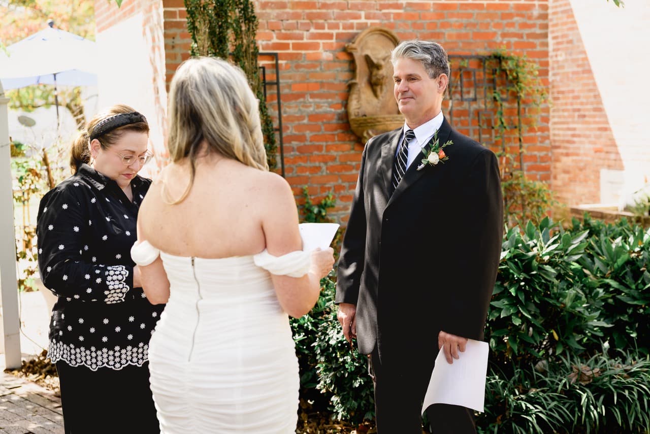 A bride and groom exchanging vows during a micro weddfing ceremony at Inner Banks Inn in Edenton, NC