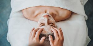 A woman getting a facial at a spa in North Carolina