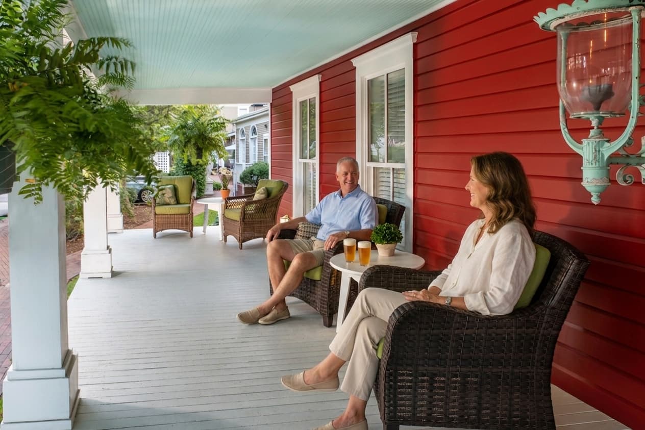 A couple on the front porch of our North Carolina bed and breakfast during a North Carolina getaway