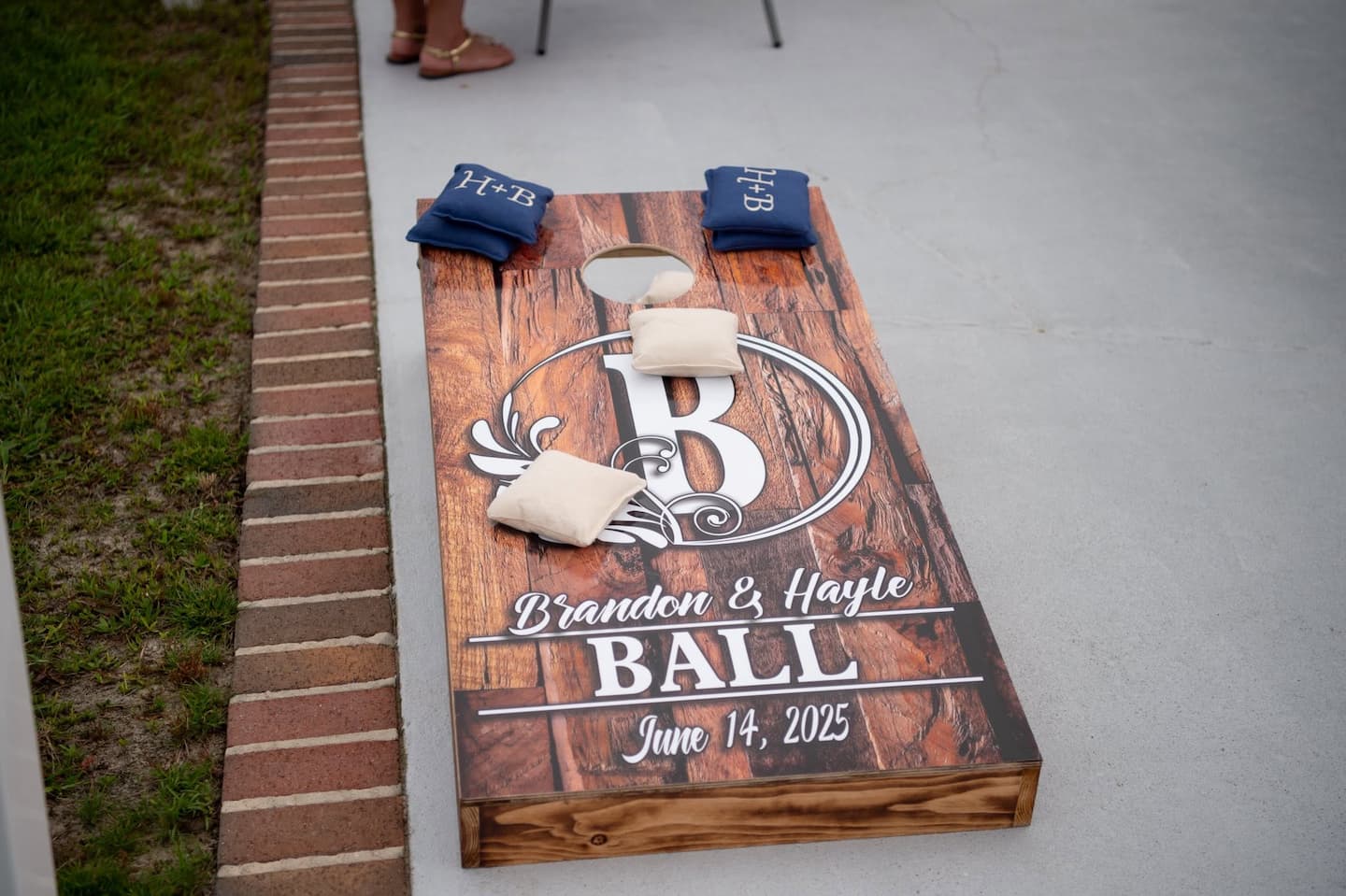 Custom corn hole boards at a rehearsal dinner at our NC wedding venue